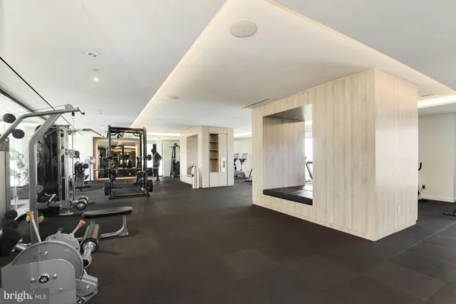 a view of a livingroom with gym equipment