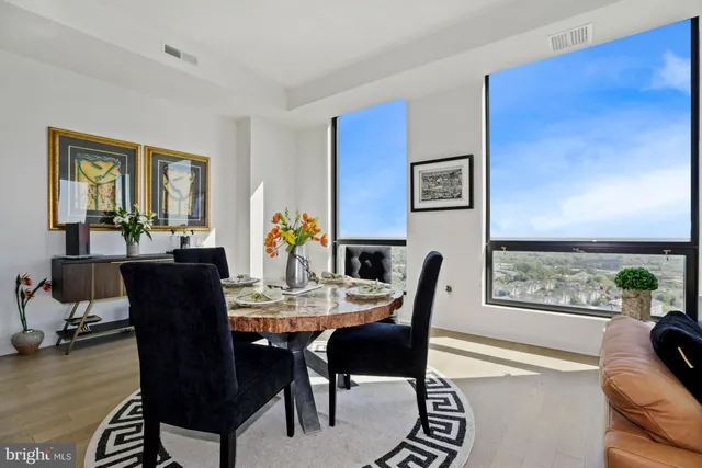 a view of a dining room with furniture window and wooden floor