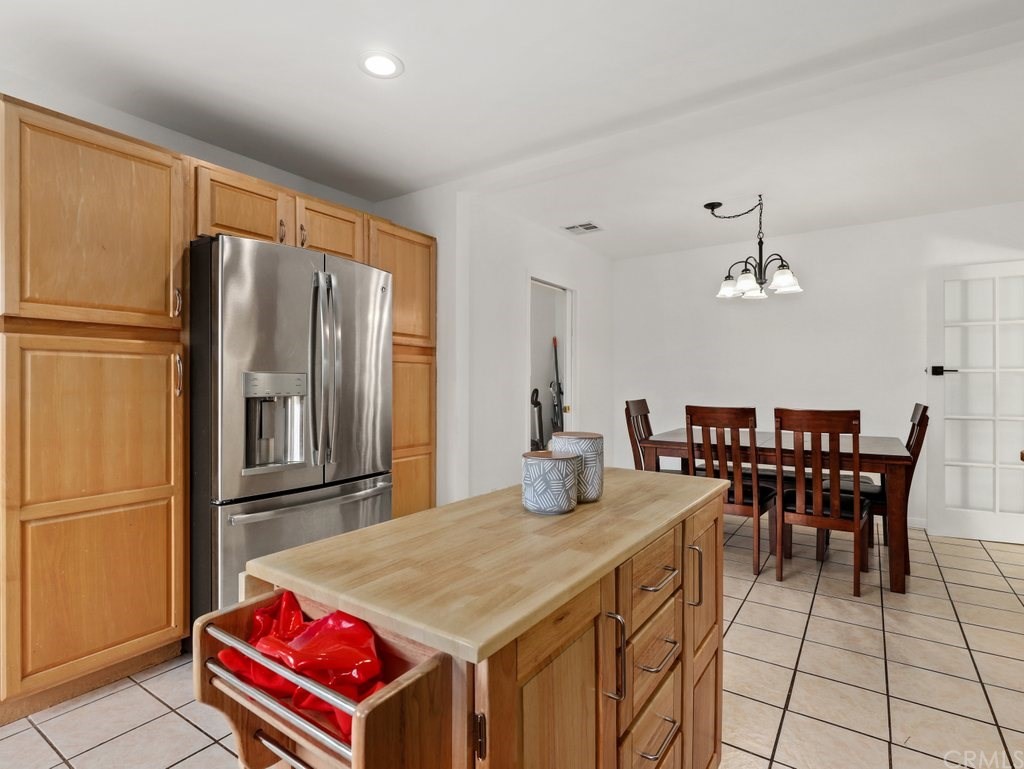 7356 Leescott Avenue Van Nuys, CA 91406 - Photo 15 of 31 a dining hall with stainless steel appliances granite countertop a dining table and chairs