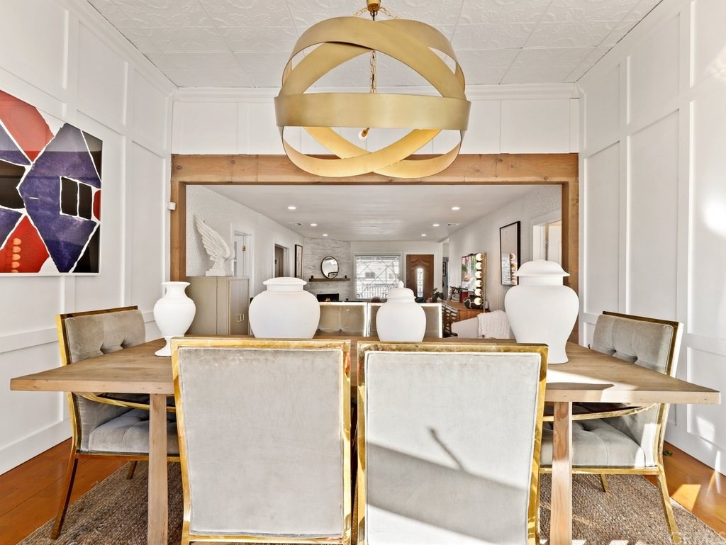 7356 Leescott Avenue Van Nuys, CA 91406 - Photo 18 of 31 a living room with a fireplace and a table