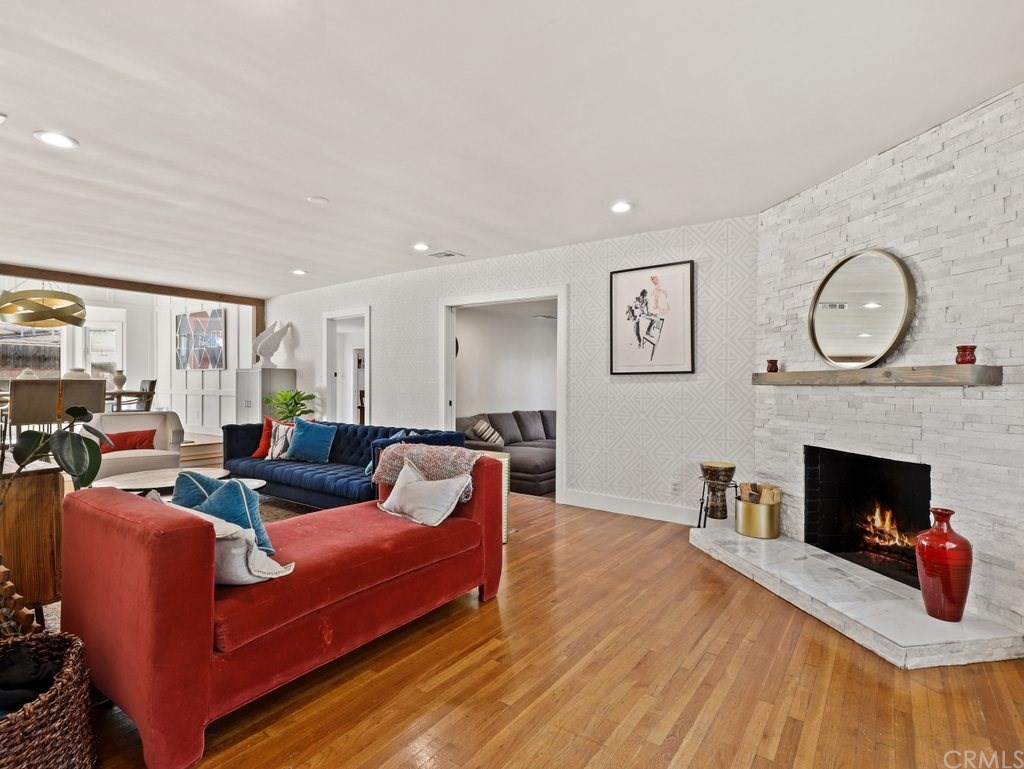 7356 Leescott Avenue Van Nuys, CA 91406 - Photo 22 of 31 a living room with furniture and a fireplace