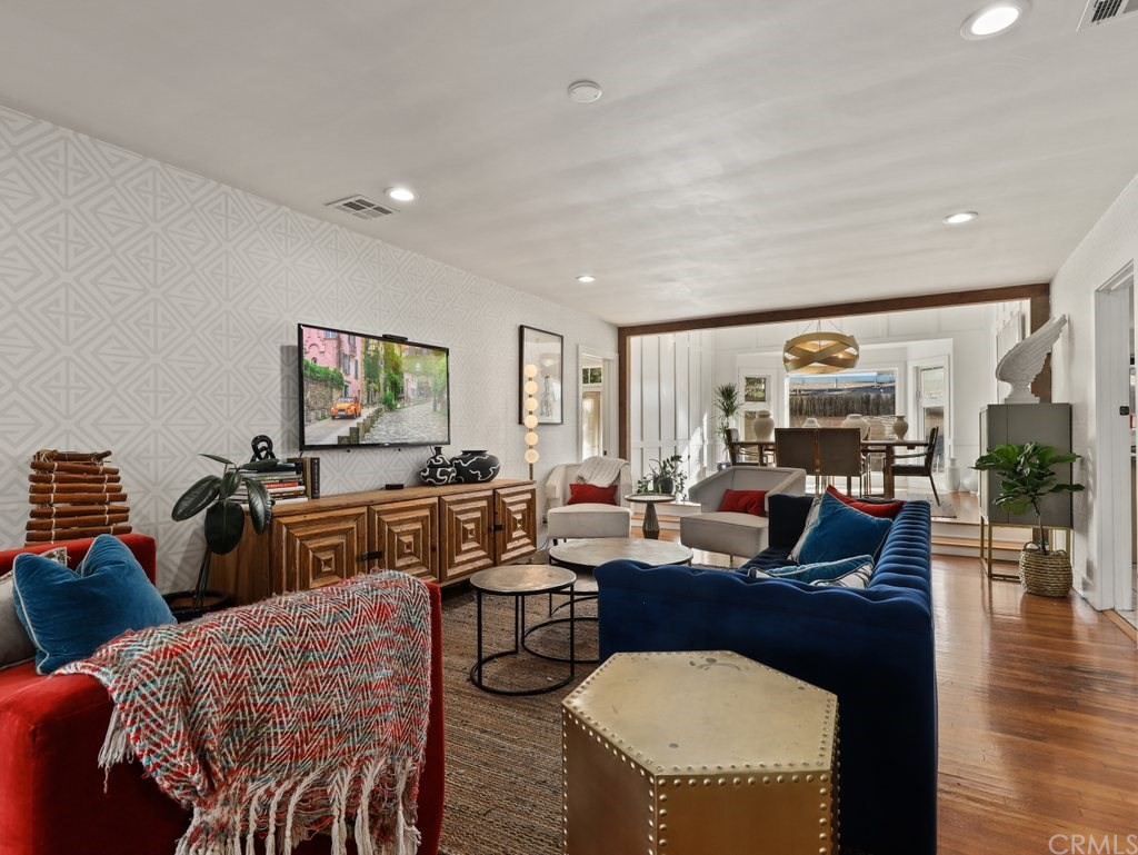 7356 Leescott Avenue Van Nuys, CA 91406 - Photo 23 of 31 a living room with fireplace furniture and a flat screen tv