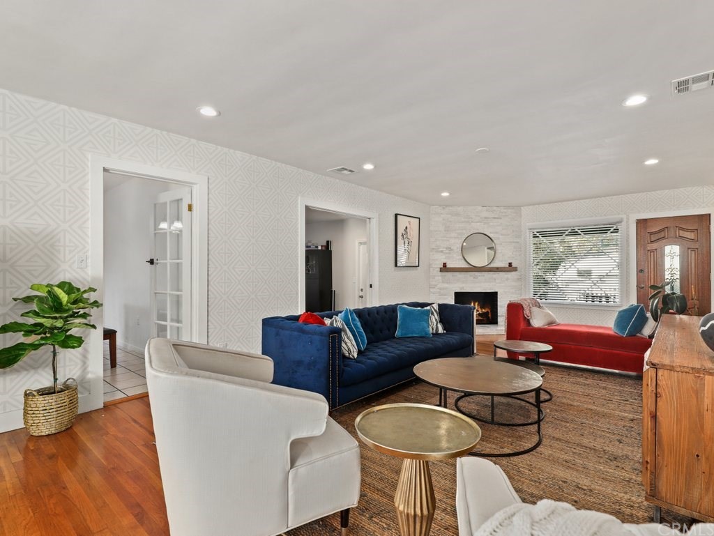 7356 Leescott Avenue Van Nuys, CA 91406 - Photo 24 of 31 a living room with furniture potted plant and a window