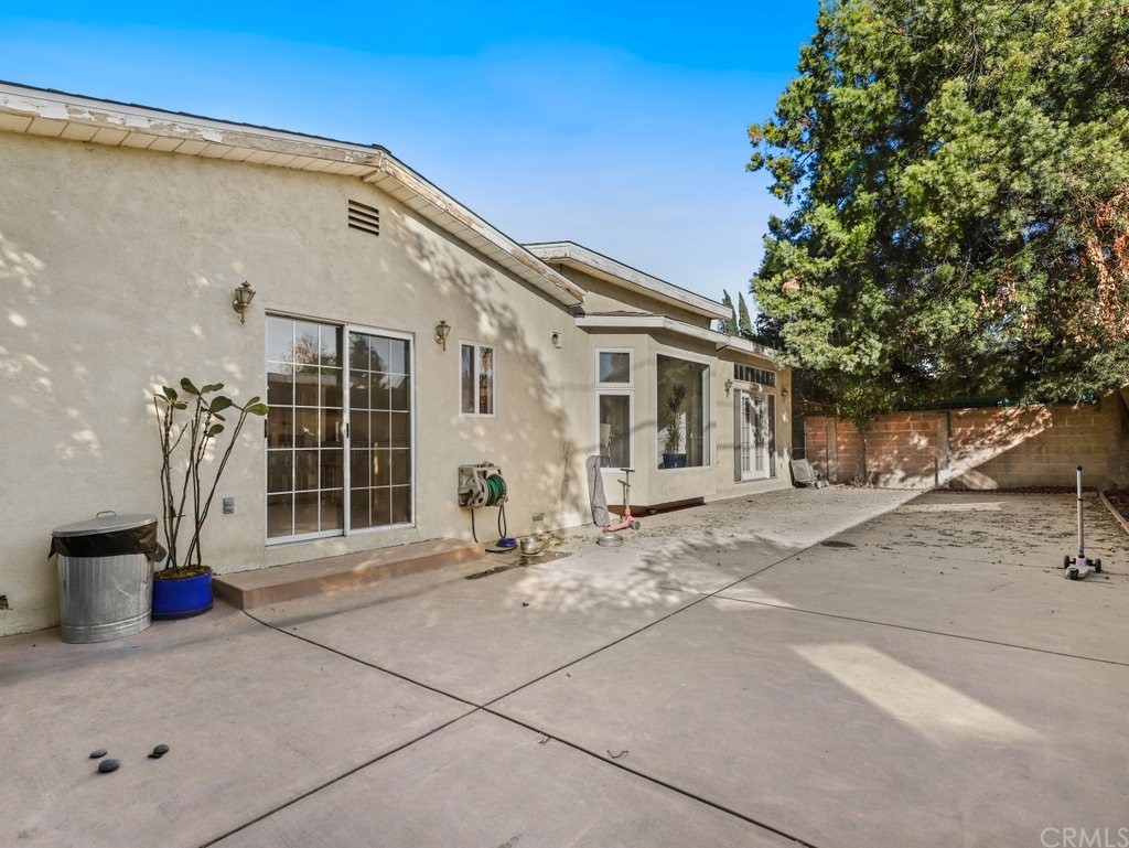 7356 Leescott Avenue Van Nuys, CA 91406 - Photo 27 of 31 a backyard of a house with table and chairs