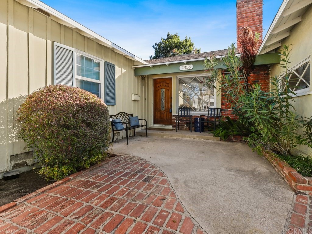 7356 Leescott Avenue Van Nuys, CA 91406 - Photo 30 of 31 a view of a house with backyard and sitting area