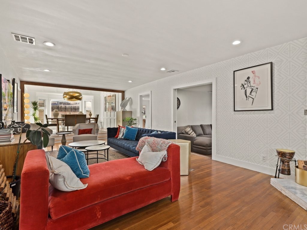 7356 Leescott Avenue Van Nuys, CA 91406 - Photo 5 of 31 a living room with furniture kitchen view and a large window