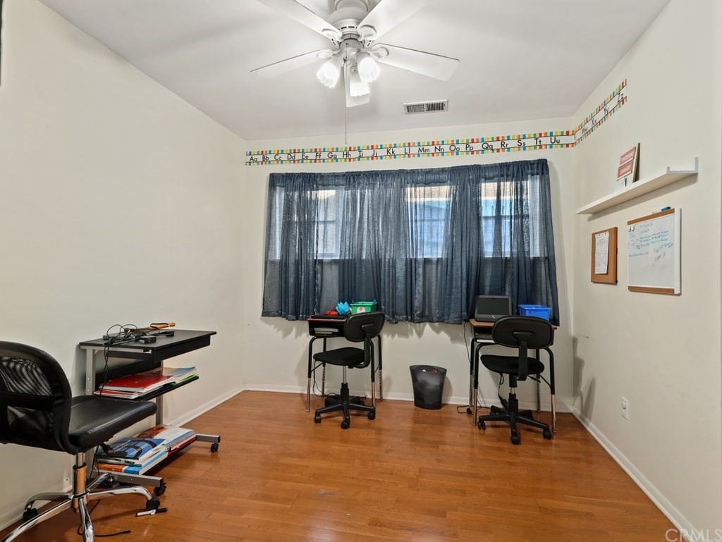 7356 Leescott Avenue Van Nuys, CA 91406 - Photo 6 of 31 a view of a workspace with furniture and a window