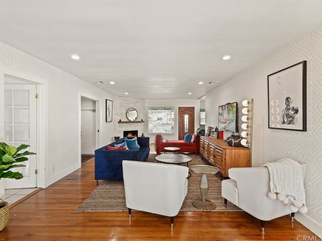 7356 Leescott Avenue Van Nuys, CA 91406 - Photo 10 of 31 a living room with furniture or wooden floor and a potted plant