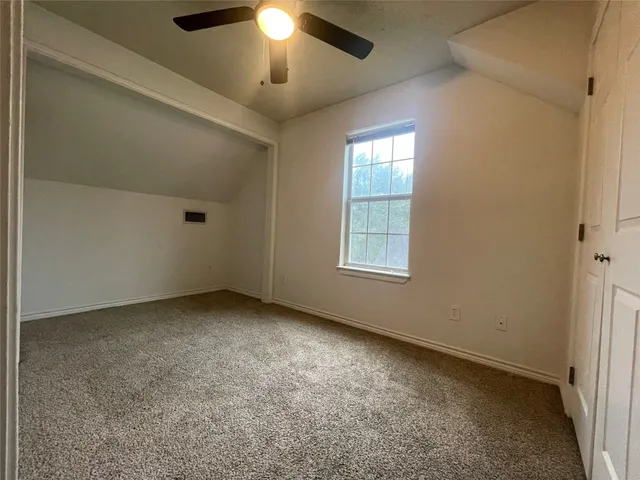 an empty room with a empty space and a window