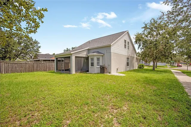a view of a house with backyard and garden