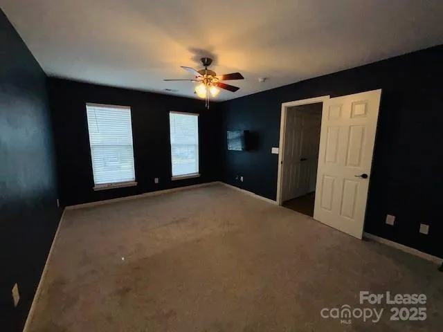 a view of a livingroom with a ceiling fan