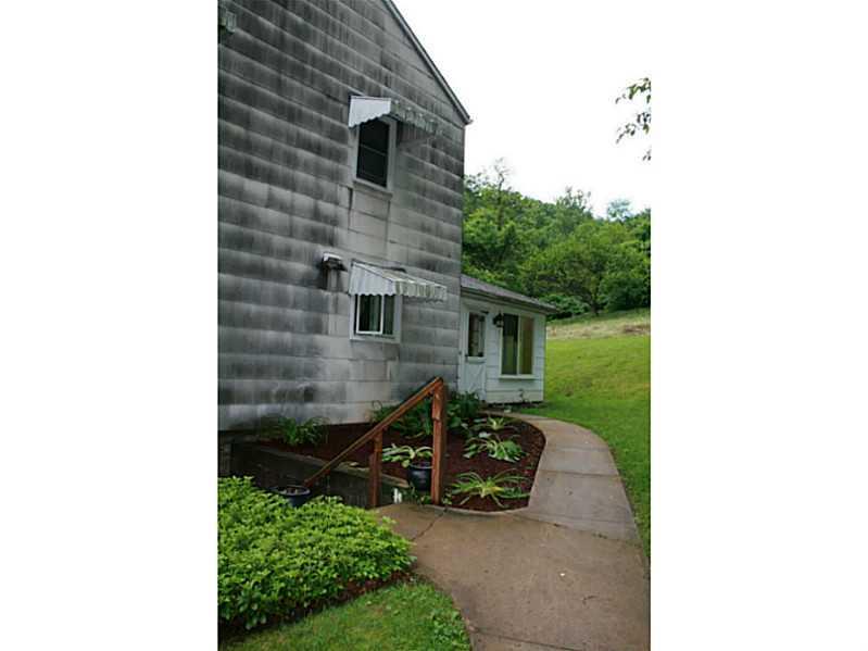 910 Geyer Road Pittsburgh, PA 15209 - Photo 19 of 20 Exterior Front. Walk up a cut path to a private and serene bench overlooking nature not neighbors.