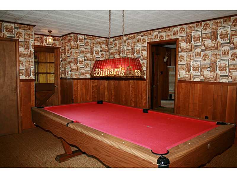 910 Geyer Road Pittsburgh, PA 15209 - Photo 6 of 20 Den/Family/Great Room. Pool table with overhanging lighting included in sale.