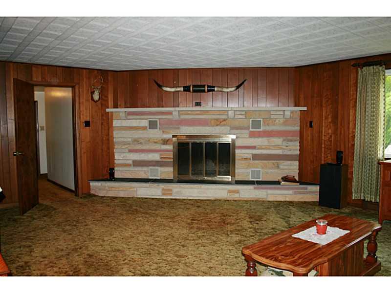 910 Geyer Road Pittsburgh, PA 15209 - Photo 7 of 20 Living Room. Wood burning stone with mantle fireplace located in the living room.