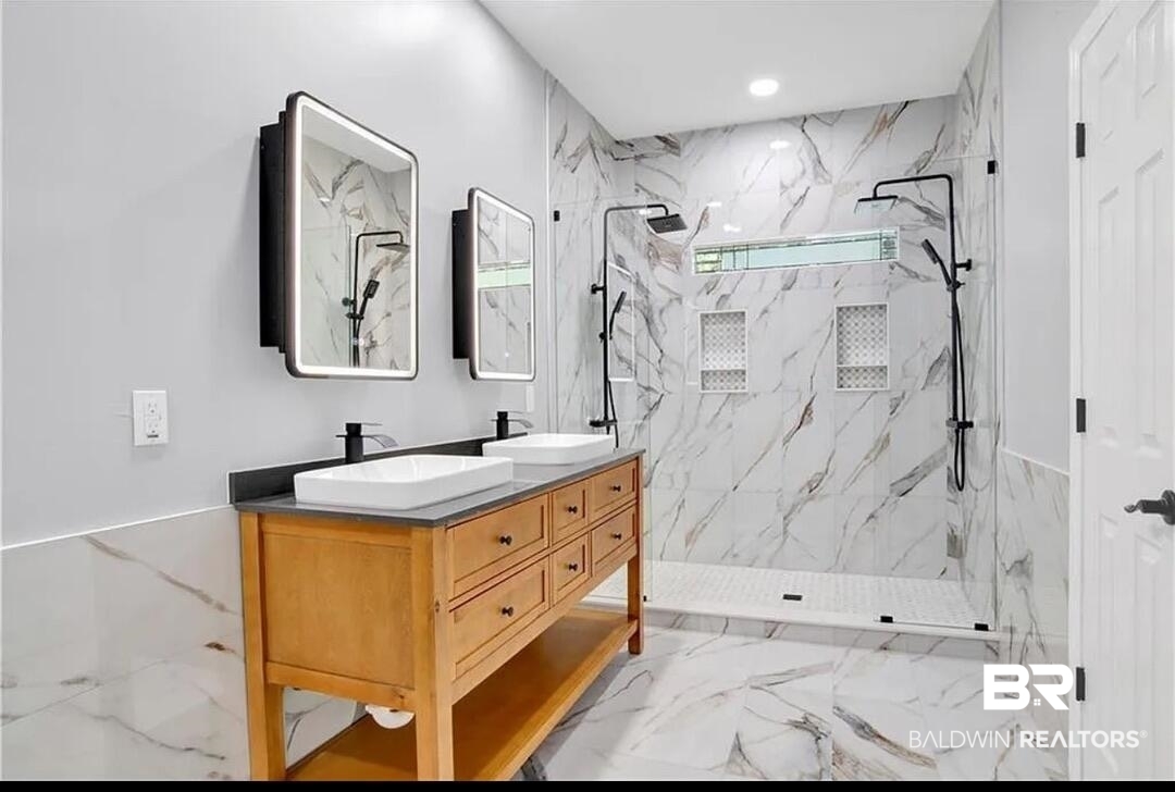 632 Ridgewood Drive Daphne, AL 36526 - Photo 31 of 36 Bathroom with vanity and a tile shower