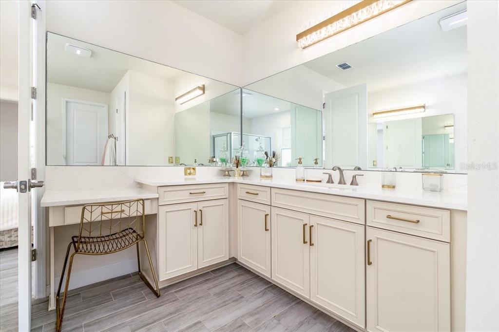 1296 Waterview Ridge Circle Apopka, FL 32703 - Photo 30 of 60 a spacious bathroom with a double vanity sink and a mirror