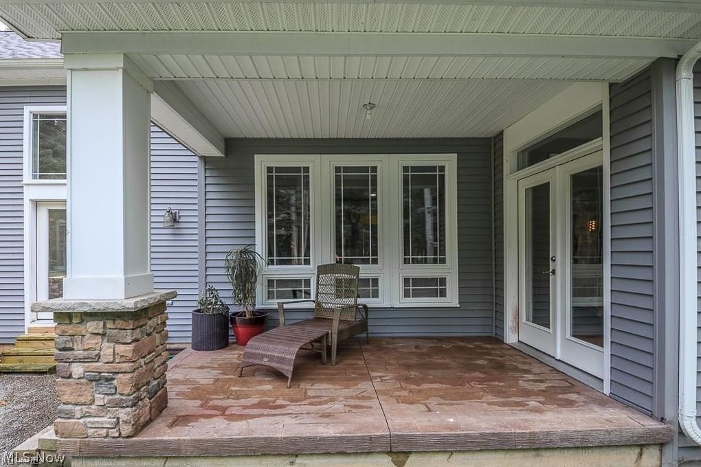 12464 Hotchkiss Road Burton, OH 44021 - Photo 12 of 35 Imagine Sipping Coffee or a Glass of Wine on Your Private Patio - Note the Stamped Concrete and Stone Accents!