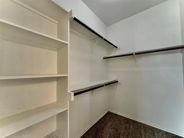 a view of an empty walk in closet