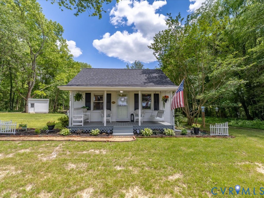 4 Memory Lane Cumberland, VA 23040 - Photo 1 of 37 a front view of a house with a yard table and chairs
