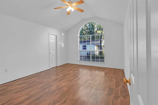a view of an empty room with a window