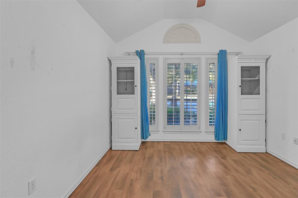 1108 Pine Ridge Drive Azle, TX 76020 - Photo 28 of 40 an empty room with wooden floor and windows