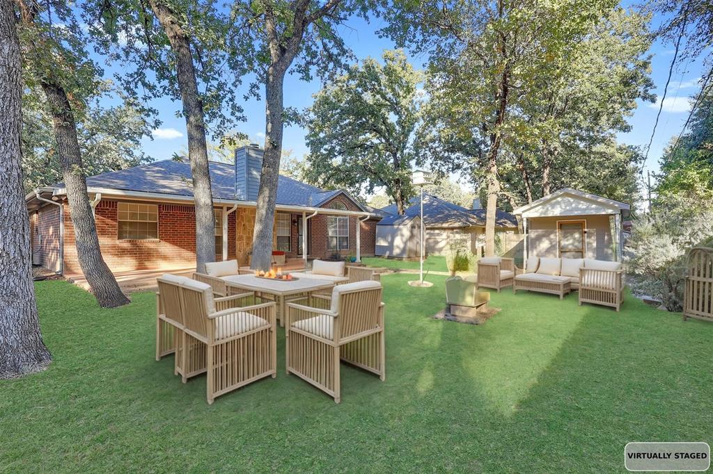 1108 Pine Ridge Drive Azle, TX 76020 - Photo 37 of 40 a view of a house with backyard porch and sitting area