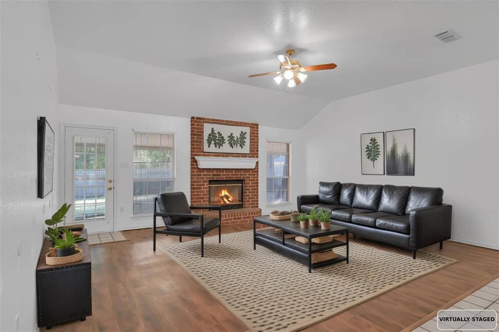 1108 Pine Ridge Drive Azle, TX 76020 - Photo 7 of 40 a living room with furniture and a fireplace
