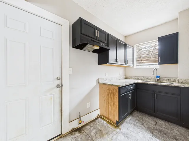 a bathroom with a sink a vanity and mirror