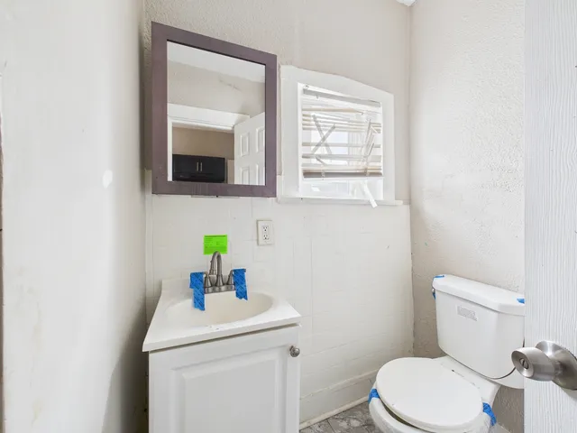 an empty room with wooden floor