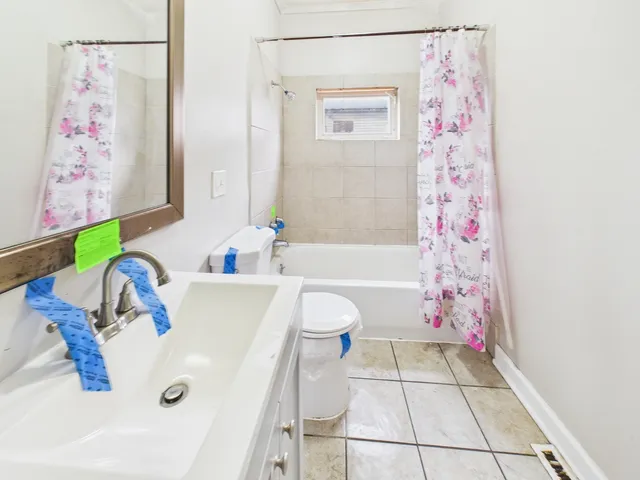 a kitchen with stainless steel appliances granite countertop a sink a stove cabinets and a refrigerator