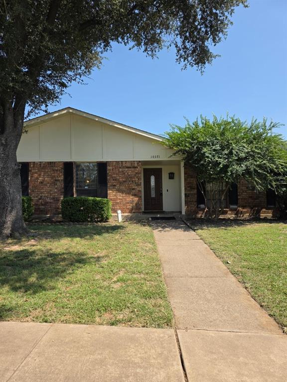 10371 White Elm Road Dallas, TX 75243 - Photo 1 of 11 Single story home with a front yard and brick siding