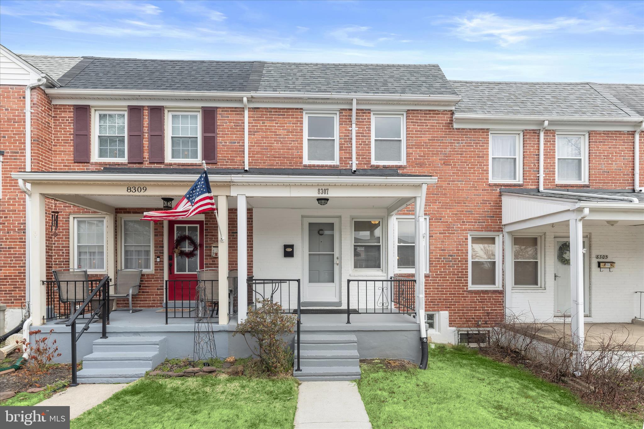 8307 Ridgely Oak Road Baltimore, MD 21234 - Photo 1 of 30 front view of a brick house with a yard