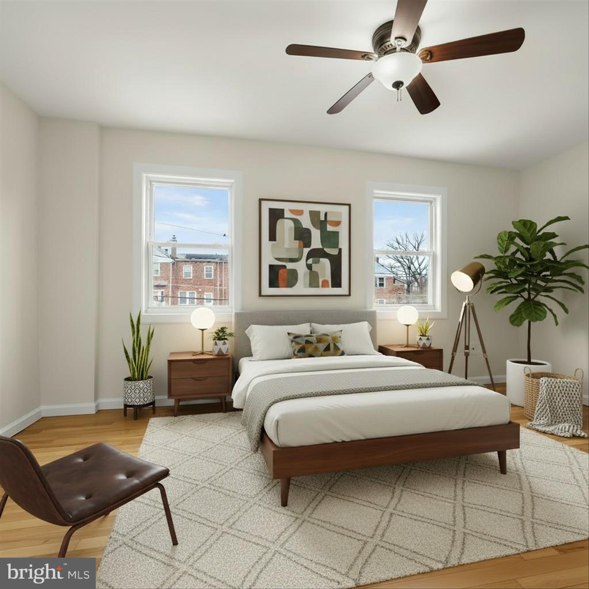 8307 Ridgely Oak Road Baltimore, MD 21234 - Photo 11 of 30 a bedroom with a large bed a chandelier and windows