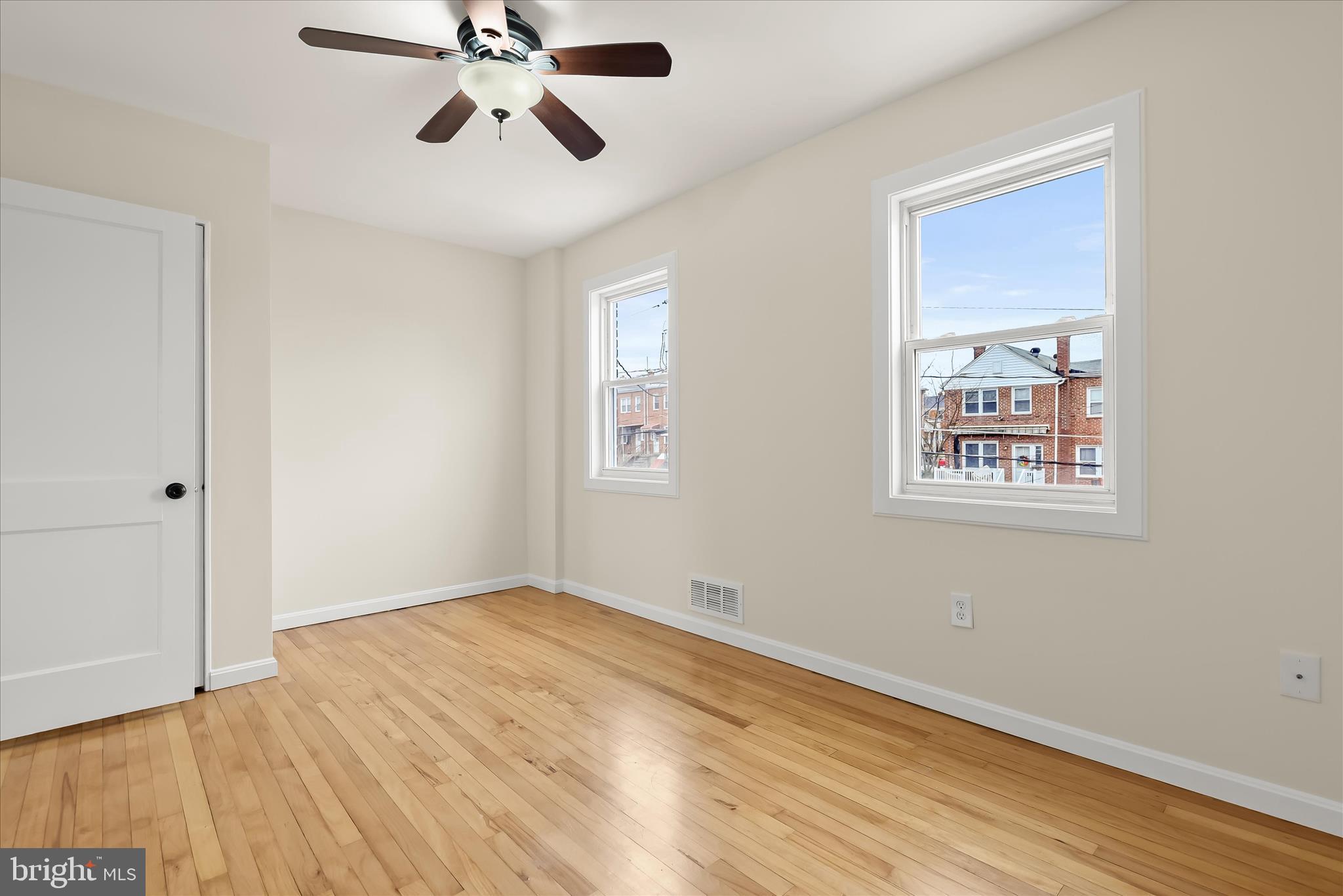 8307 Ridgely Oak Road Baltimore, MD 21234 - Photo 14 of 30 a view of empty room with wooden floor and fan
