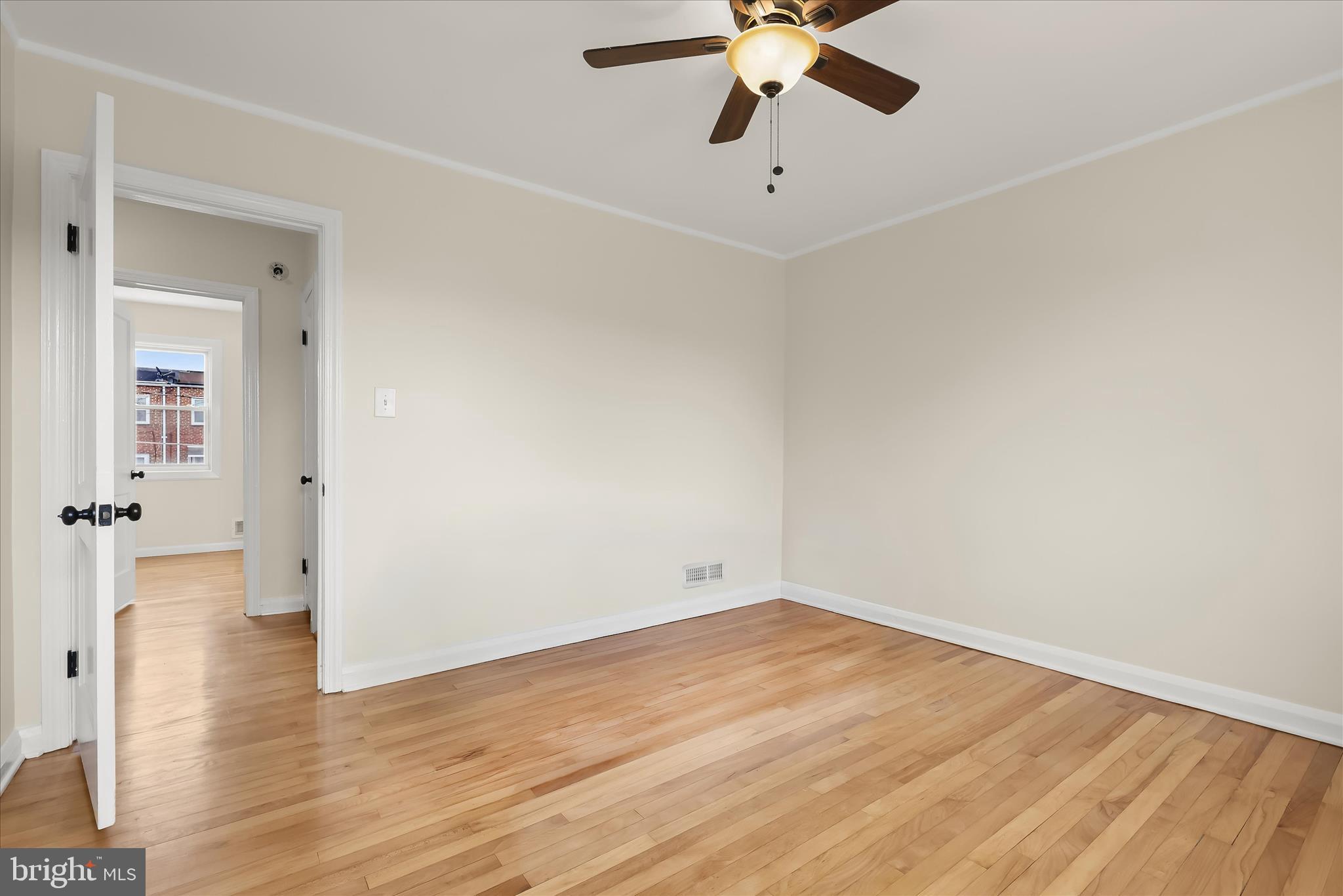 8307 Ridgely Oak Road Baltimore, MD 21234 - Photo 17 of 30 wooden floor in an empty room