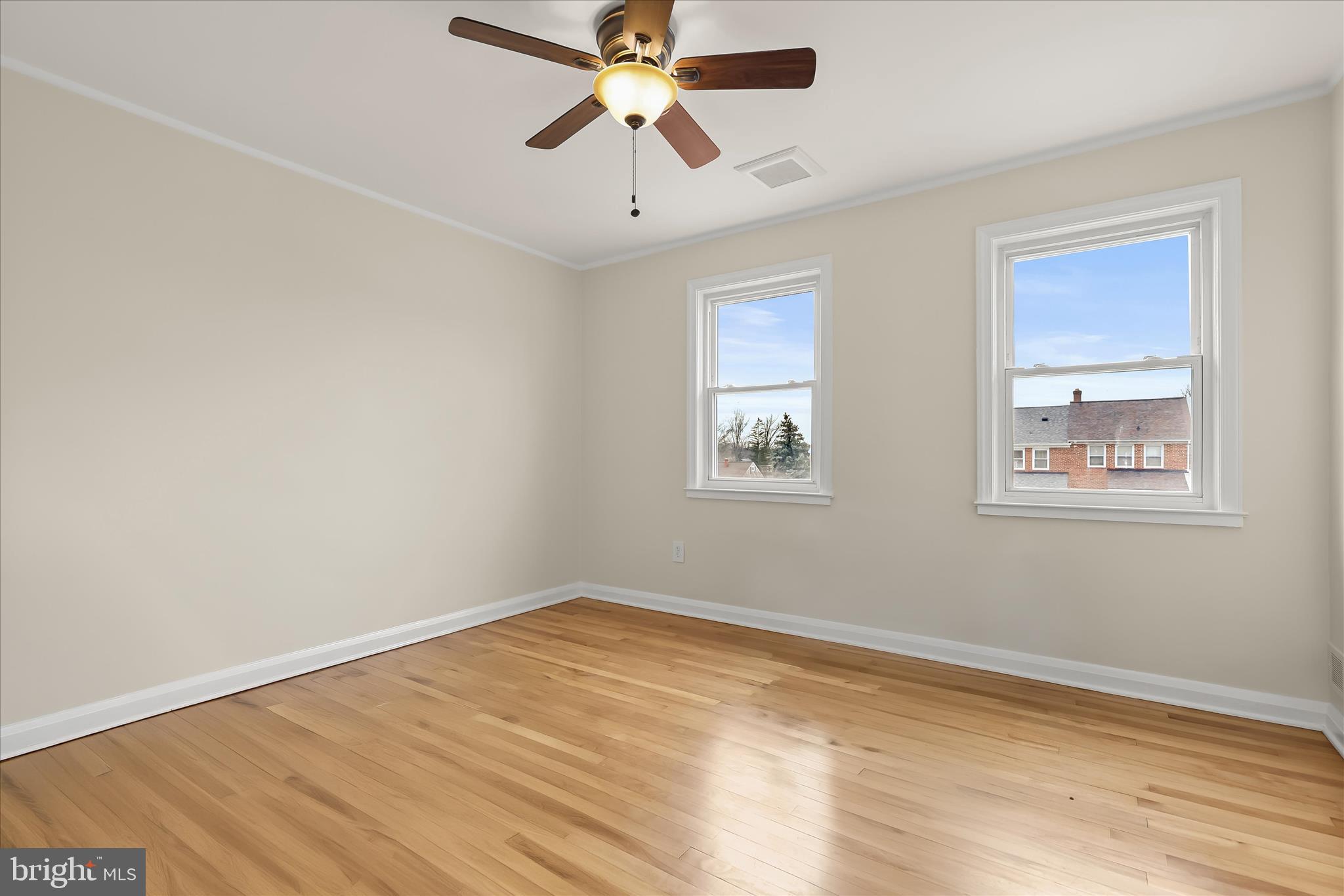 8307 Ridgely Oak Road Baltimore, MD 21234 - Photo 18 of 30 a view of a room with wooden floor and windows