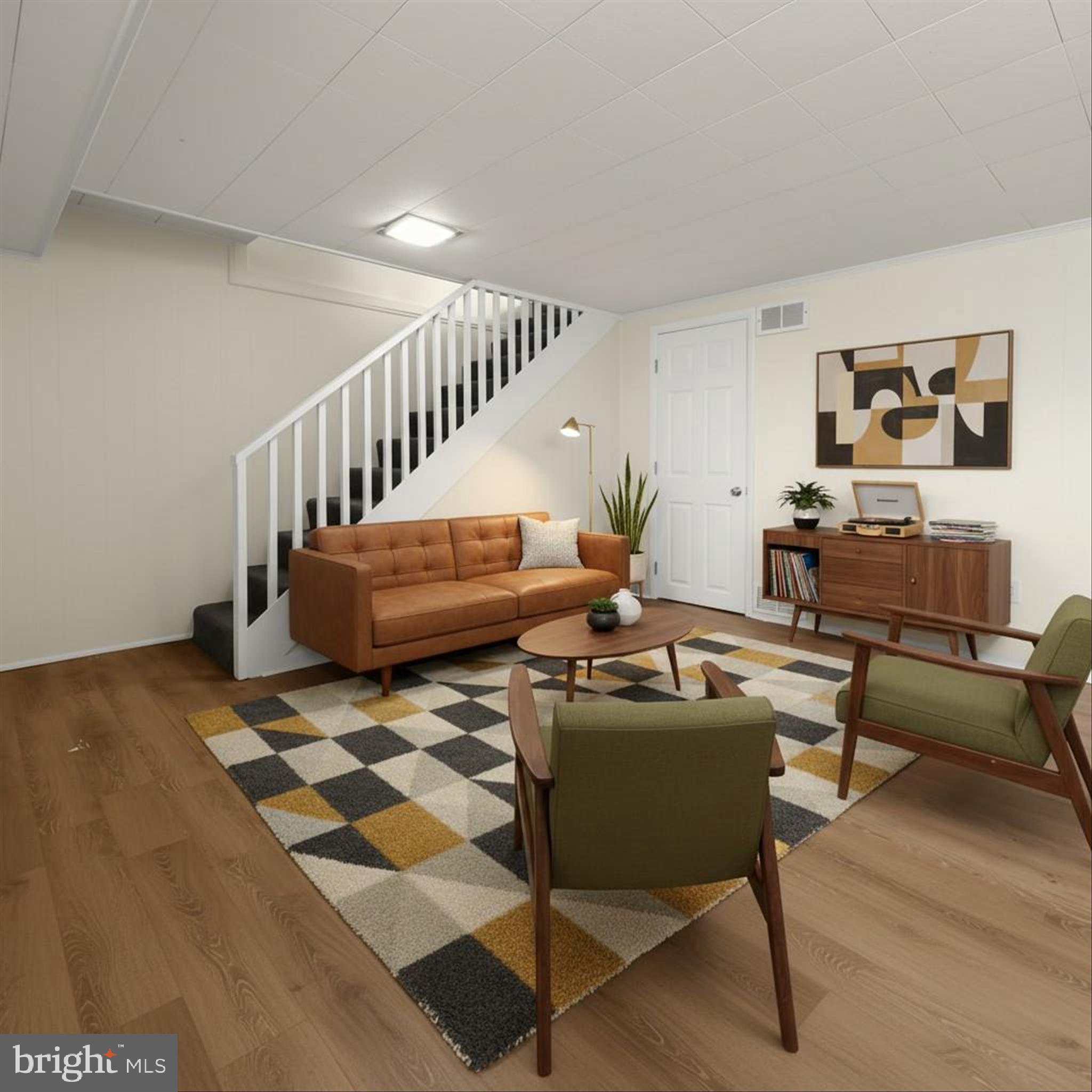 8307 Ridgely Oak Road Baltimore, MD 21234 - Photo 19 of 30 a living room with furniture and wooden floor