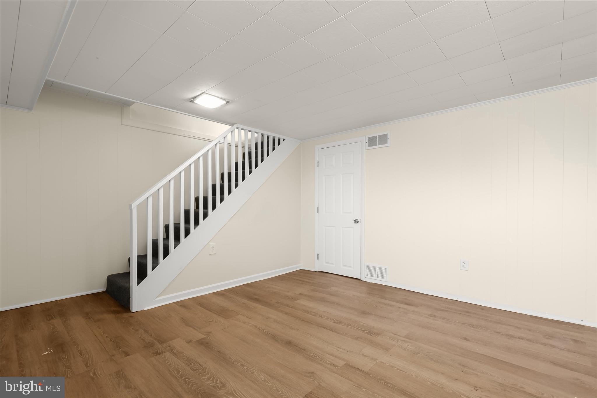 8307 Ridgely Oak Road Baltimore, MD 21234 - Photo 20 of 30 a view of an empty room with wooden floor
