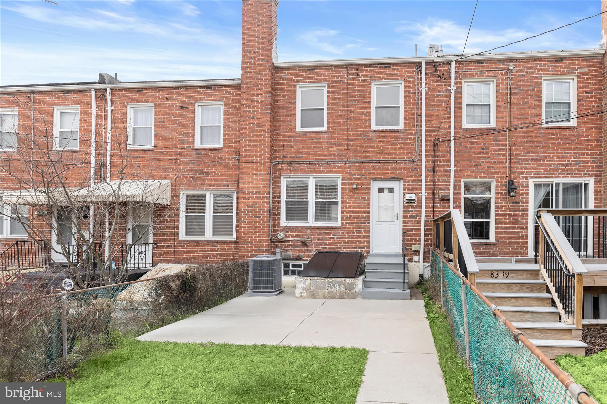 8307 Ridgely Oak Road Baltimore, MD 21234 - Photo 24 of 30 a front view of a house with barbeque and outdoor seating