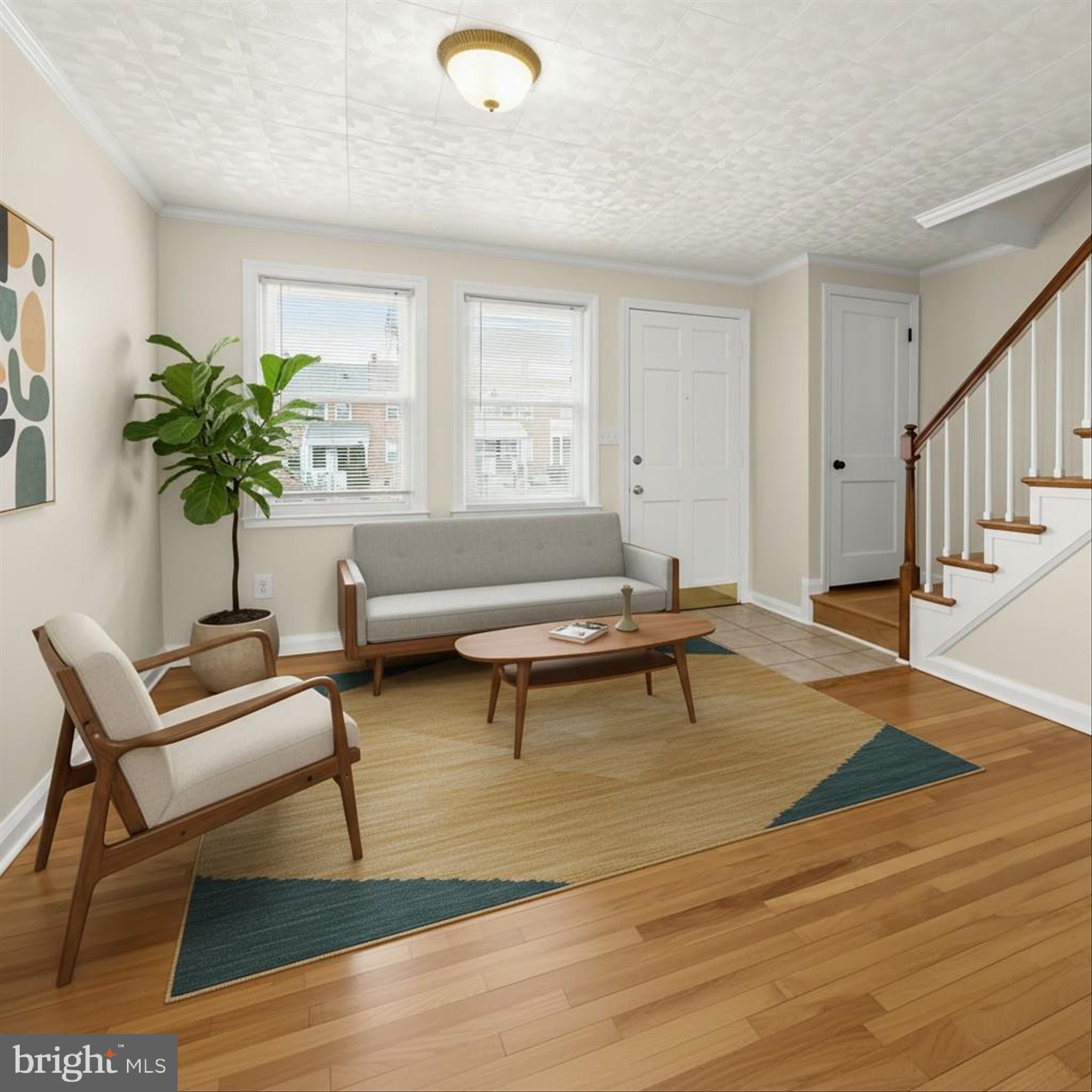 8307 Ridgely Oak Road Baltimore, MD 21234 - Photo 3 of 30 a living room with furniture and a potted plant