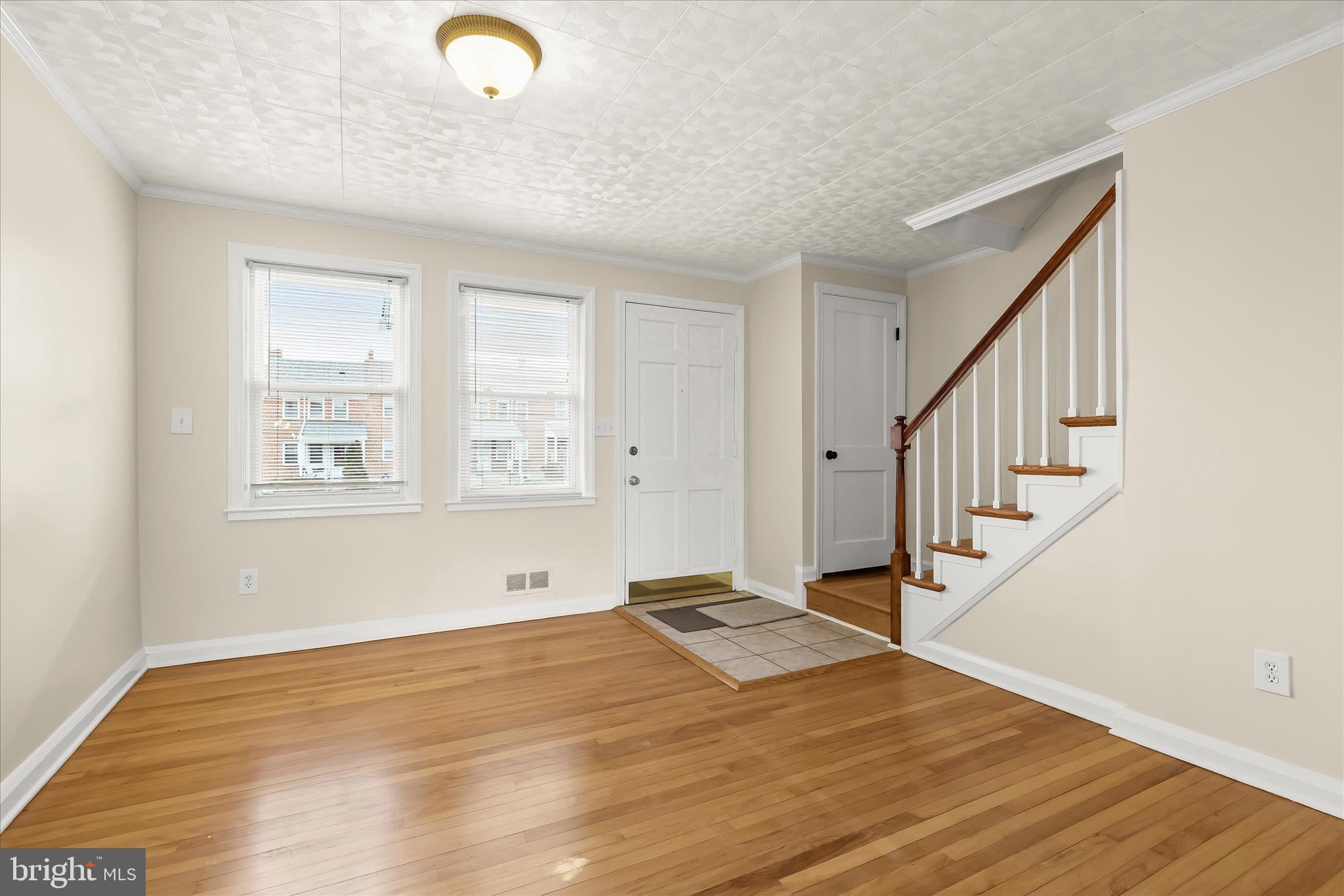 8307 Ridgely Oak Road Baltimore, MD 21234 - Photo 5 of 30 a view of empty room with wooden floor and fan