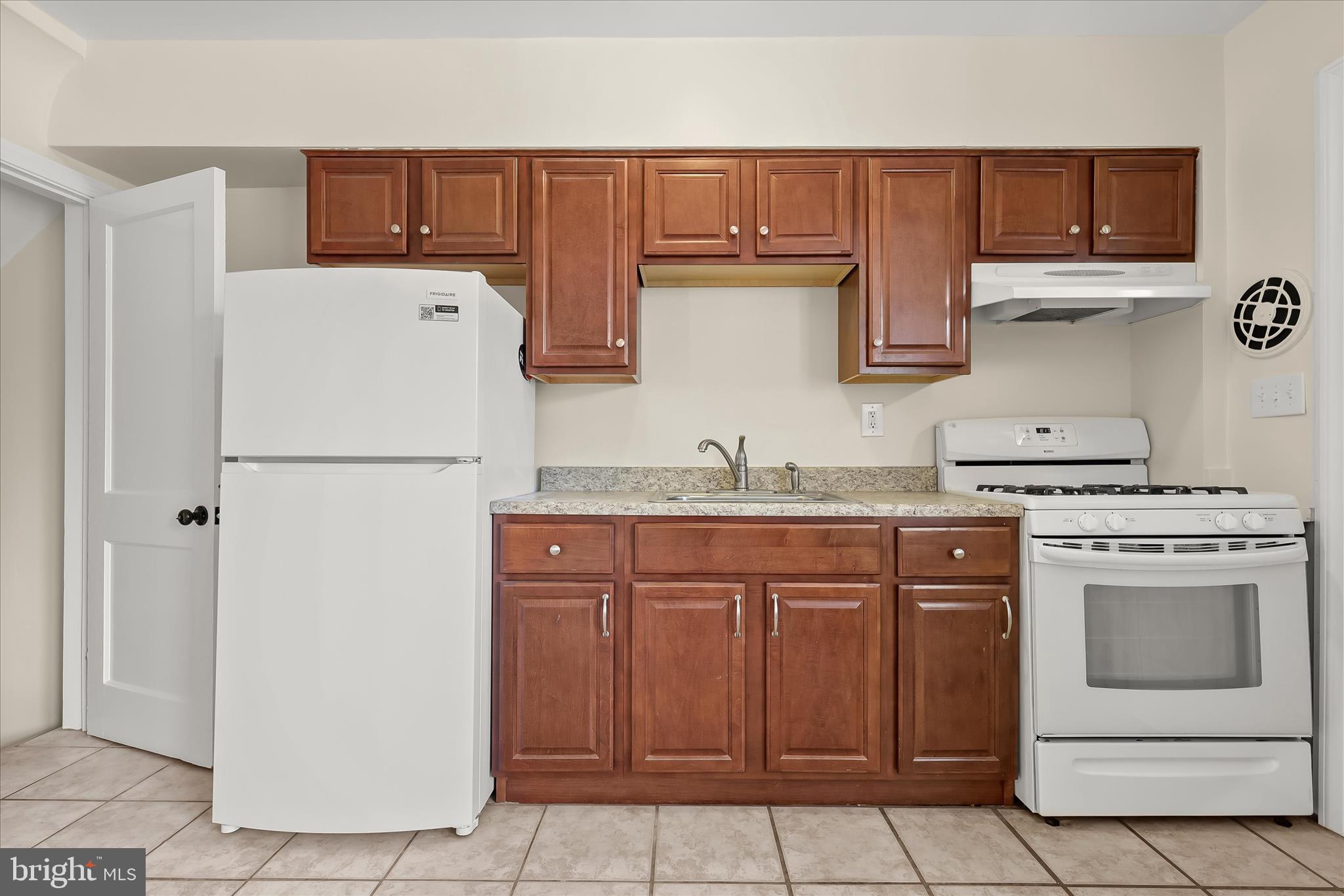 8307 Ridgely Oak Road Baltimore, MD 21234 - Photo 8 of 30 a kitchen with stainless steel appliances granite countertop a refrigerator and a stove