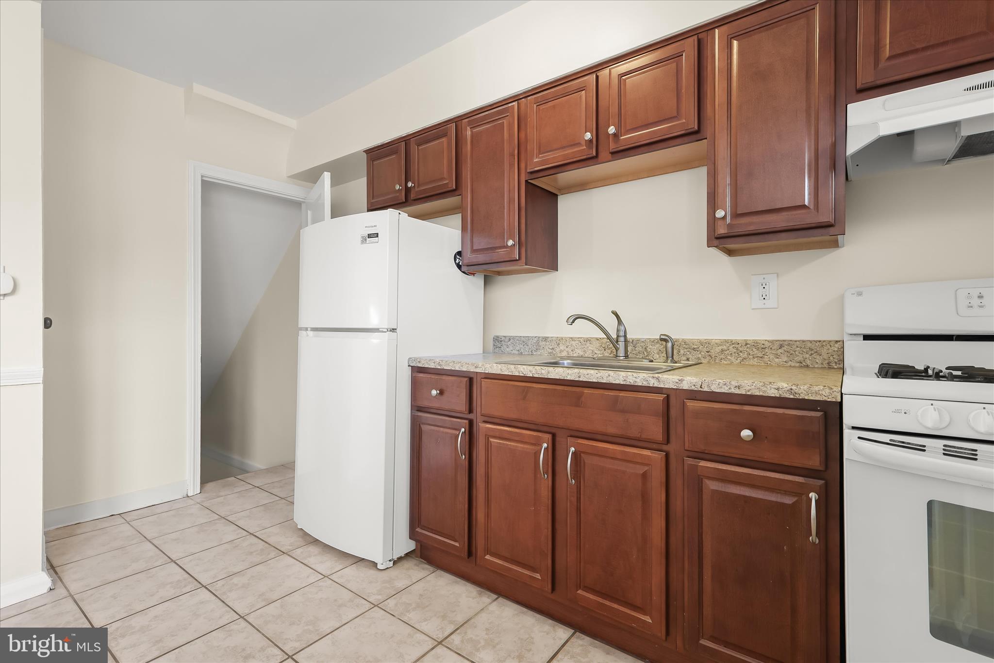 8307 Ridgely Oak Road Baltimore, MD 21234 - Photo 9 of 30 a kitchen with stainless steel appliances granite countertop a refrigerator and a sink