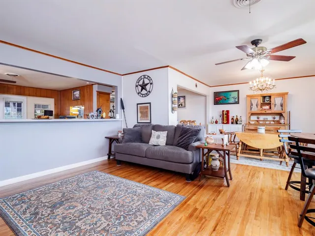 a living room with furniture and a rug