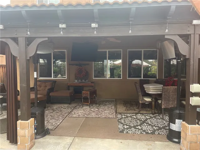 a lobby with furniture and a rug