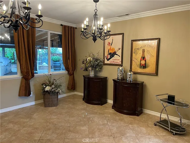 a dining room with furniture and window