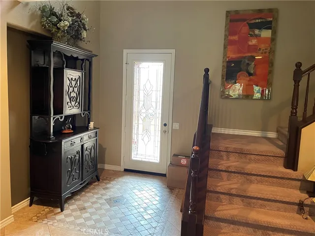 a view of an entryway with front door