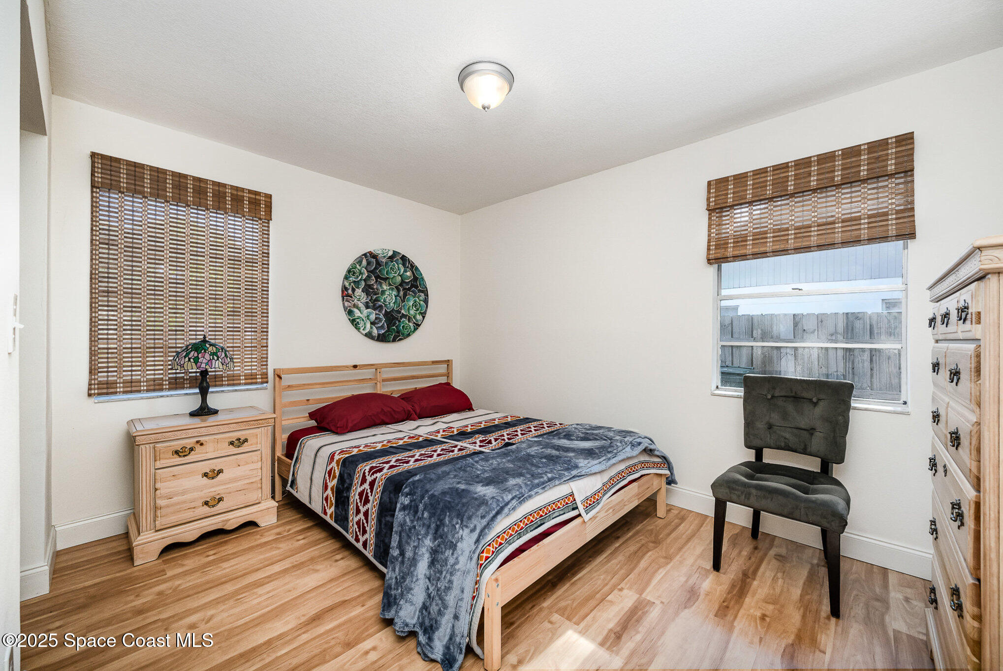 233 Beverly Road Cocoa, FL 32922 - Photo 11 of 20 a bedroom with a bed and a desk