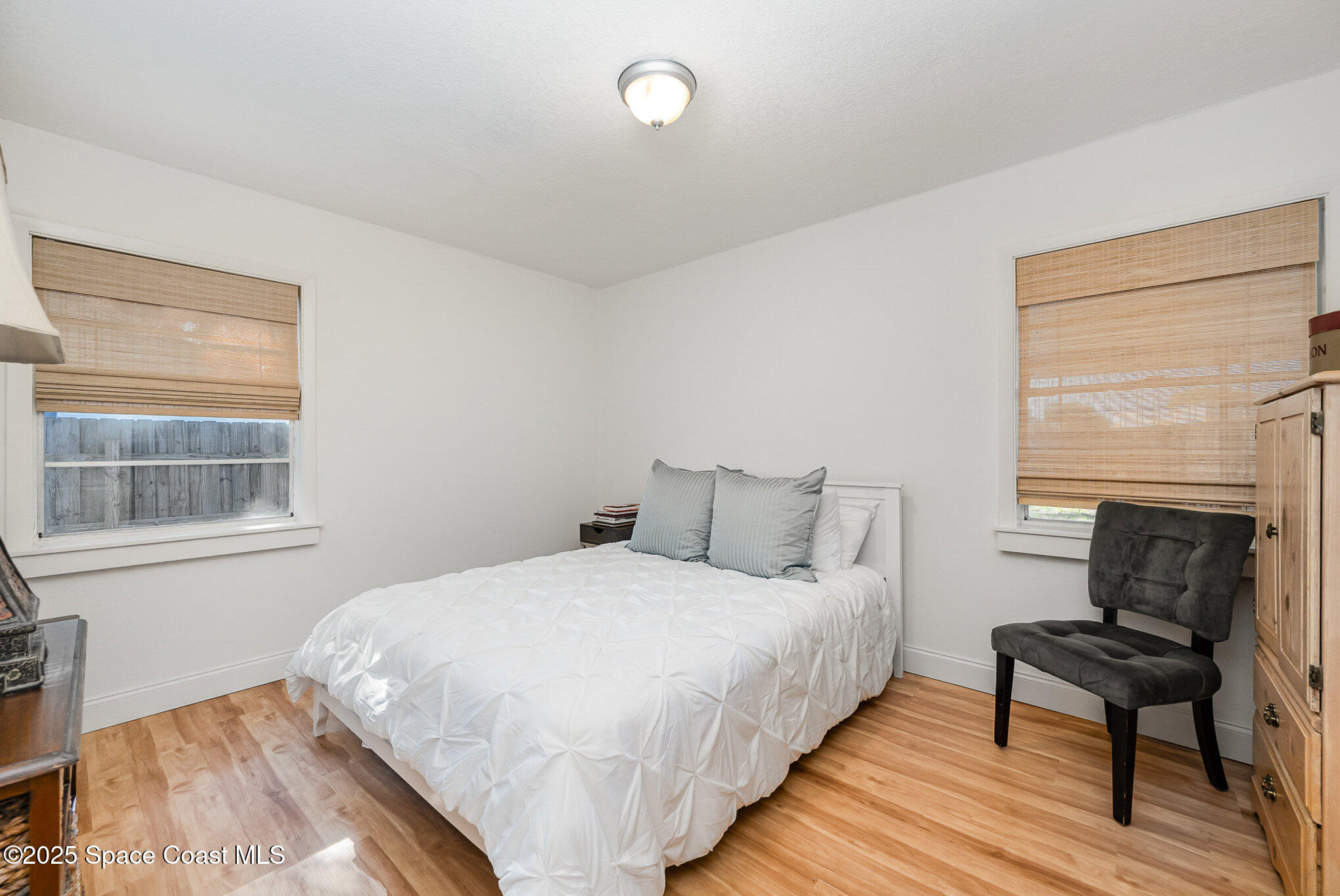 233 Beverly Road Cocoa, FL 32922 - Photo 14 of 20 a bedroom with a bed and a window