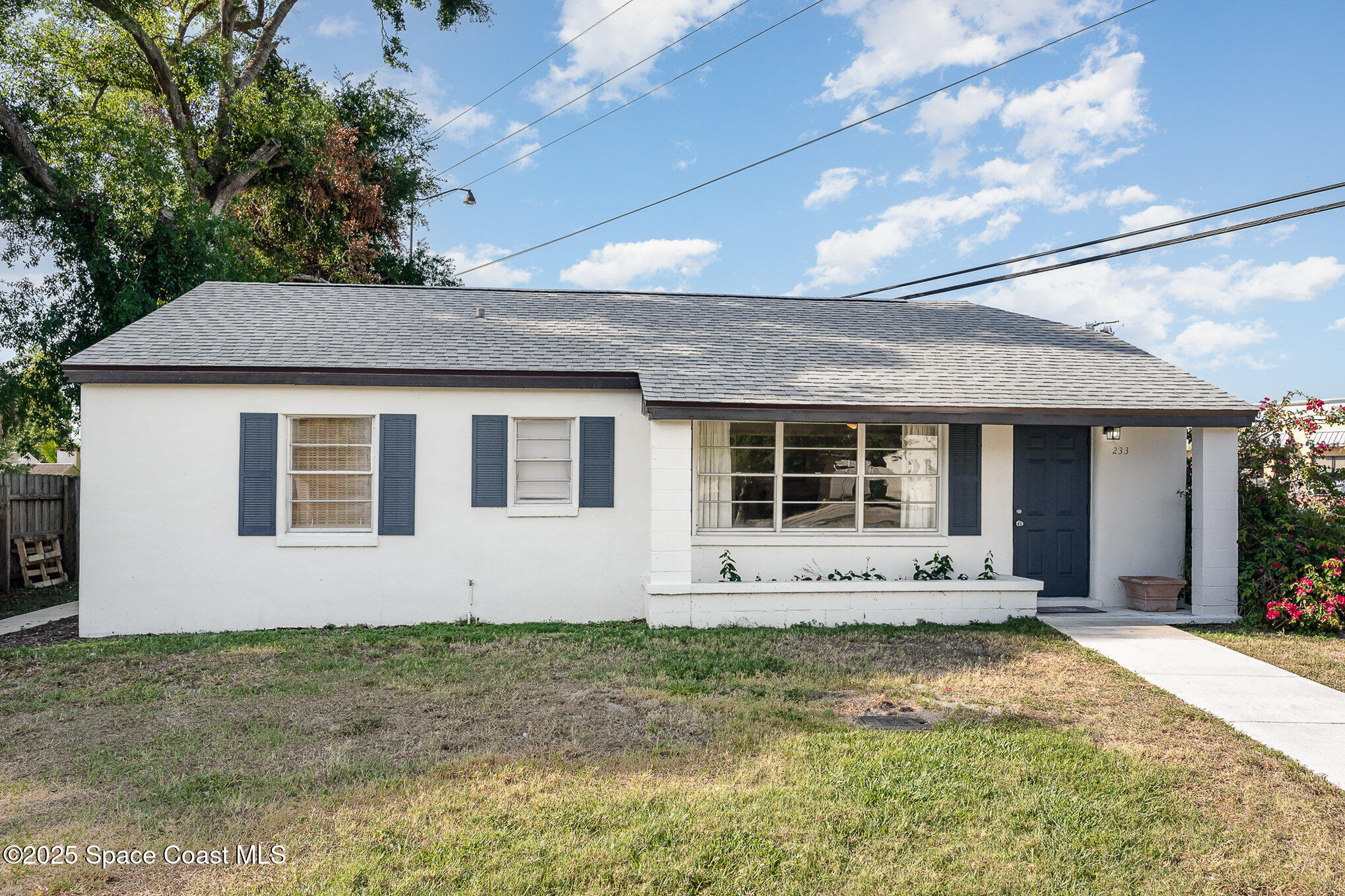 233 Beverly Road Cocoa, FL 32922 - Photo 2 of 20 a front view of a house with yard